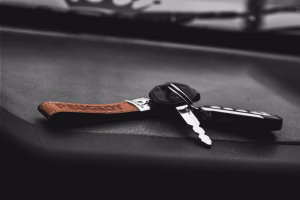 Car keys resting on a Maryland vehicle title document
